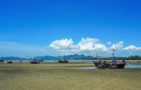 Prajubkirikrun, Thailand-July 18,2016: Wooden fishing boat on a sandy beachの写真素材