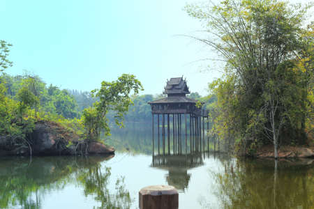 Reflection of Thai old style pavilion in the water.の写真素材