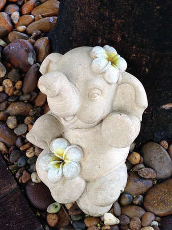 Rock animal Doll in the gravel garden.の写真素材