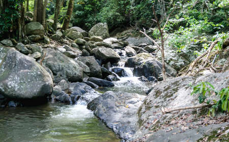 Landscape view of water stream near waterfall in summer, Thailand, trekking and hiking concept.の写真素材