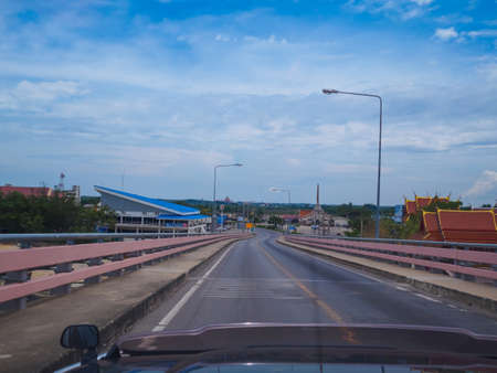 On the way travelling, view on the bridge to city from the driverÃ¢ï¿½ï¿½s angle, blue sky background.のeditorial素材