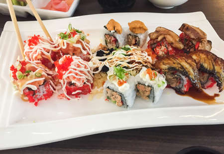 Mixed sushi, Japanese food, arranged in white plate.の写真素材