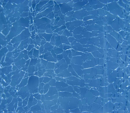 The broken glass of dark blue colourの写真素材