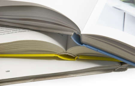 The opened books lie a stack