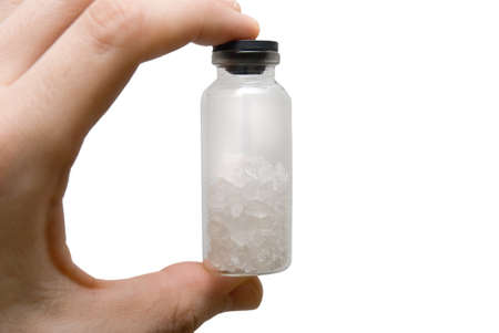 Test tube in fingersの写真素材