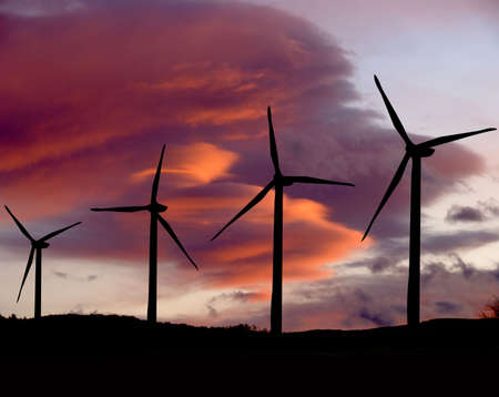 Wind farm propellers at sunsetの写真素材