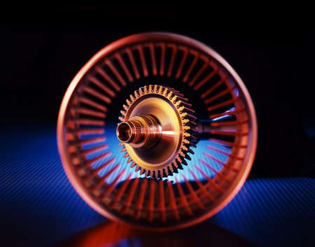 Stainless steel machined parts in color on dark blueの写真素材