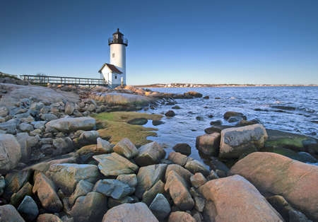 Lighthouse at dawn off Anisquam, Massachusettsの写真素材