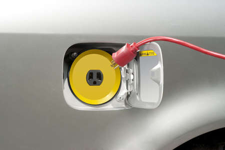 Electric car about to be recharged with regular household currentの写真素材