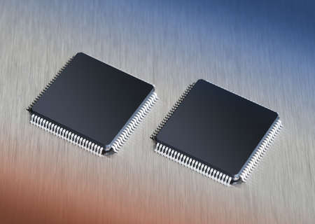 Two computer chips on stainless steel background with blue and orange gradientの写真素材