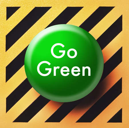 Go green button on yellow and black panelの写真素材