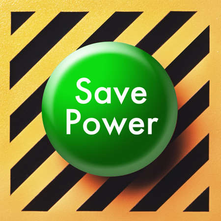 Save power button in green on yellow and black panelの写真素材