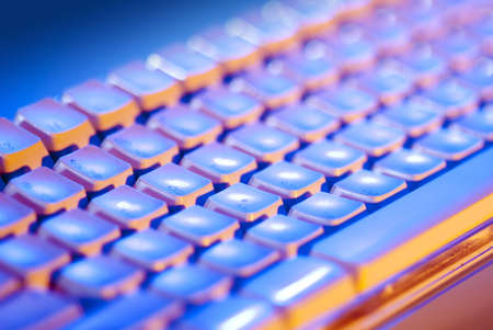 Computer Keyboard with blue and orange lighting の写真素材