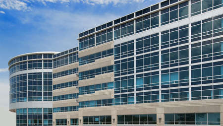 Modern office building in glass and concreteの写真素材