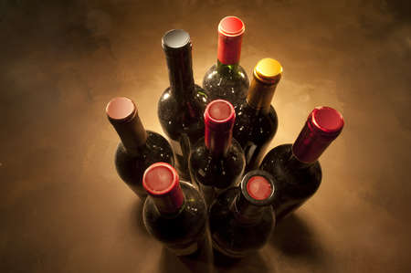 Wine bottles in perspective on warm backgroundの写真素材