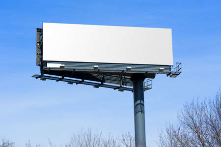 Blank big billboard over blue sky, put your own text here の写真素材