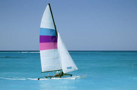 Sailboat or catamaran on caribbean watersの写真素材