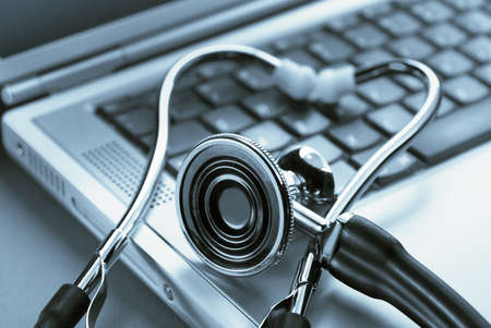 Medical stethoscope on a laptop computer, closeup の写真素材