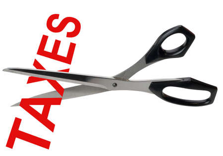 Tax cuts symbolized by scissors cutting the word taxes in red, isolated with clipping pathの写真素材