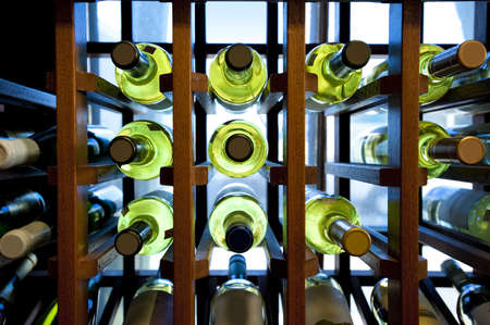 Wine bottles in wooden rack located in a small country storeの写真素材