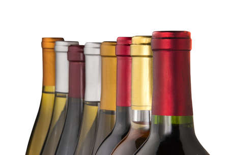 Wine bottles in a row with limited depth of field, isolatedの写真素材