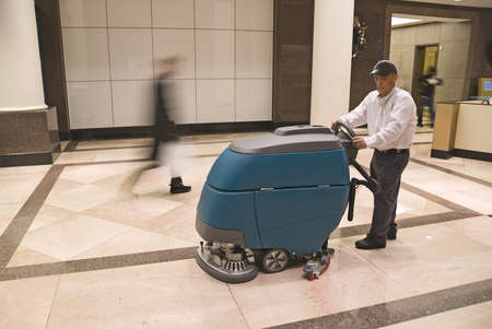Cleaning floor in office building lobbyの写真素材