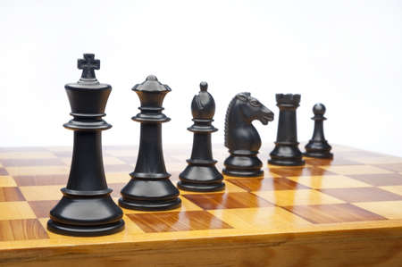 chess pieces on a white background advising to strategic behaviorの写真素材