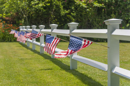 Patriotic picket white fenceの写真素材
