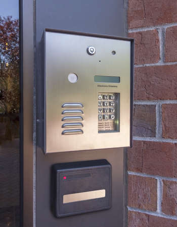 Electronic door directory and security pad near the front door entrance of a  commercial buildingの写真素材