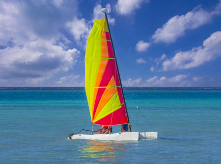 Catamaran sailboat in caribbean sea on blue sky backgroundのeditorial素材