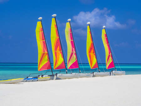 Catamaran sailboats on white sandy beachのeditorial素材