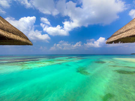 View of the aquamarine water of the Maldives from my bungalowの写真素材