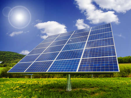 Solar panel in dandelion fieldの写真素材