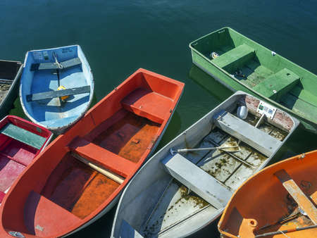 Row boats tied to dockの写真素材