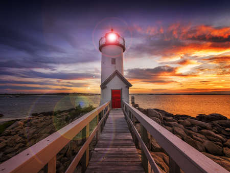Annisquam lighthouse at sunset off the coast of Gloucester, MA  USAの写真素材