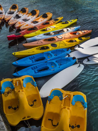 Colorful kayaks off an ocean pierの写真素材