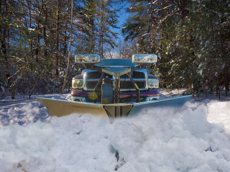 Truck plowing the snowの写真素材