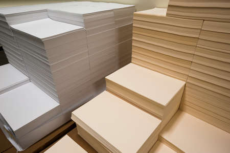 Stacks of paper on a printing plant floorの写真素材