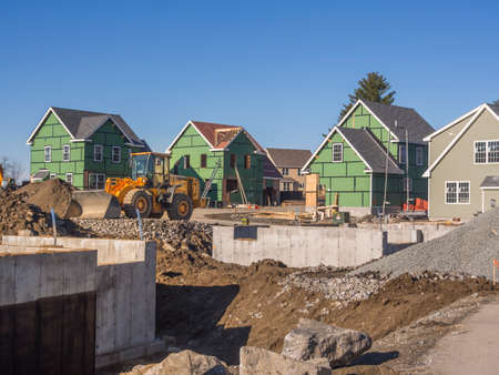 A single family home under construction in a housing development complex.の写真素材