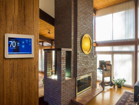 Programmable thermostat for temperature control in living roomの写真素材