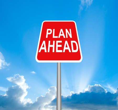 Red plan ahead sign on sky with clipping pathの写真素材