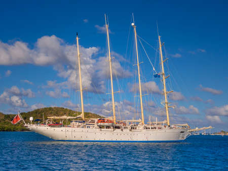Four masted sailing ship cruising the British Virgin islandsの写真素材