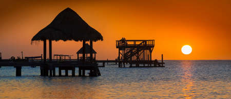 Sunset on the tropical island of Roatan, Hondurasの写真素材