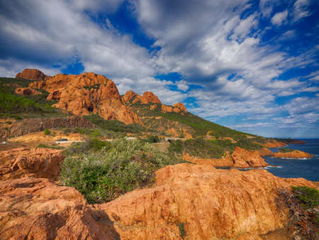 Red rocky coasline of the French Rivieraの写真素材