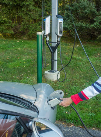 Charging an electric carの写真素材