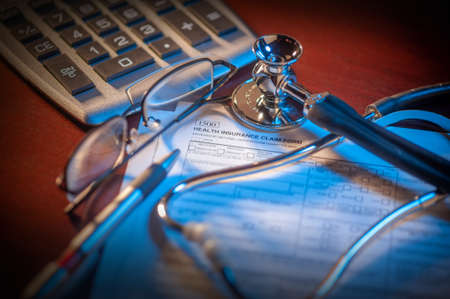 Getting ready to file a health insurance claim formの写真素材