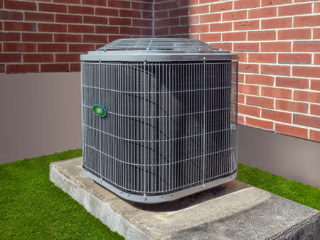 High efficiency modern AC-heater unit, energy save solution-horizontal, outside an apartment complexの写真素材