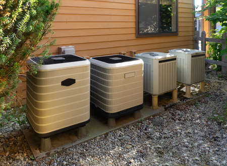 Air conditioning units outside an apartment complexの写真素材