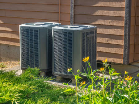 Air conditioning units outside an apartment complexの写真素材