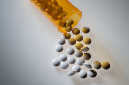 Prescription pills in orange plastic bottleの写真素材